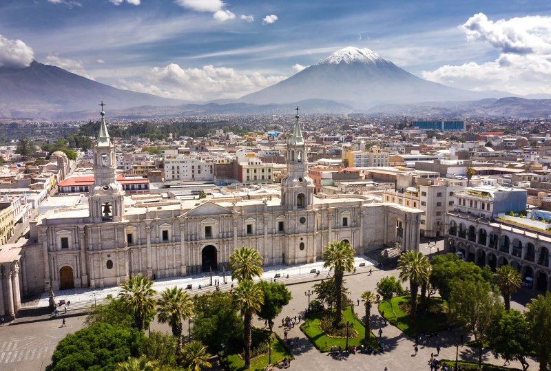 Aerial drone view of Arequipa main square and cathedral church, with the Misti volcano as background