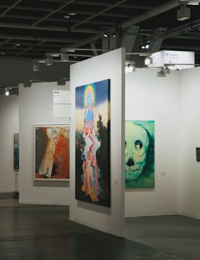 An art gallery showcases various paintings on display.