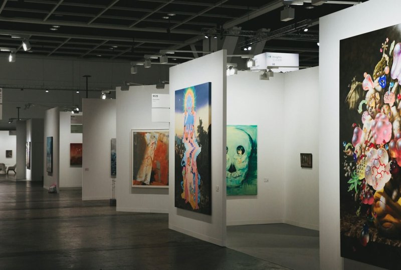 An art gallery showcases various paintings on display.