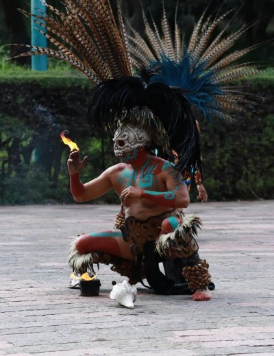 Aztec dancer performing a vibrant ritual dance in Chapultepec, Mexico City.