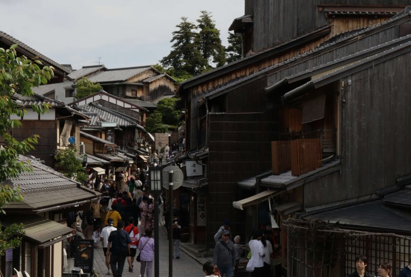 Group of travelers walking in Kyoto’s city center