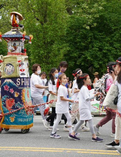 a group of people walking down a street