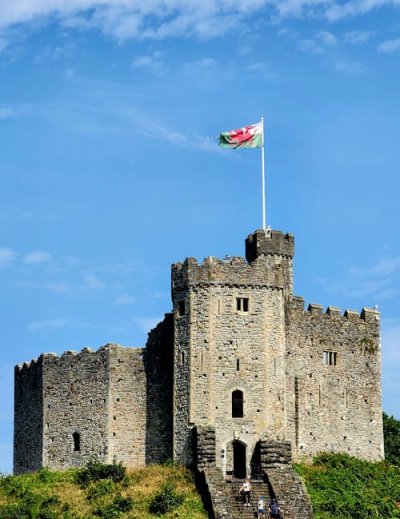 Cardiff Castle with Welsh flag and medieval stone architecture