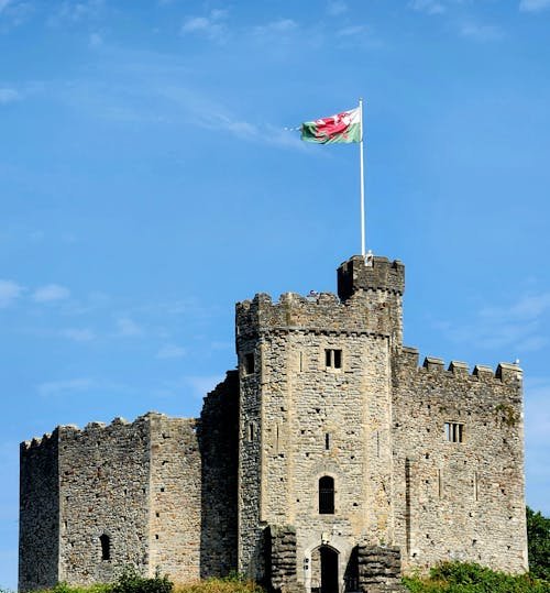 Cardiff Castle with Welsh flag and medieval stone architecture