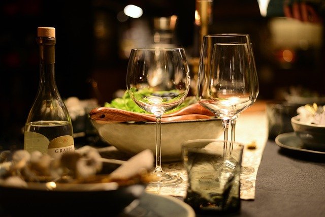 Fine dining restaurant table with wine glasses and candlelight ambiance