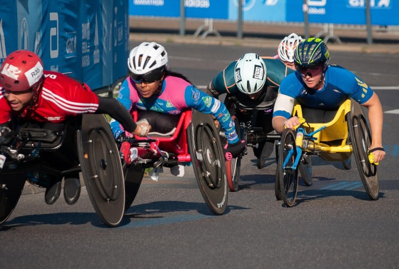Paralympic athletes competing in wheelchair racing on a track