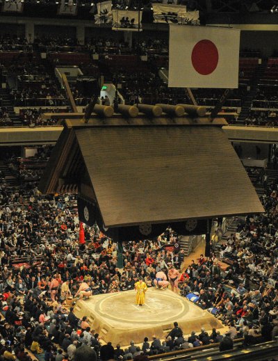Traditional sumo wrestling match in Japanese arena