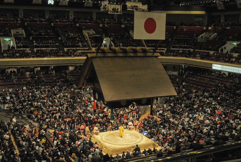 Traditional sumo wrestling match in Japanese arena